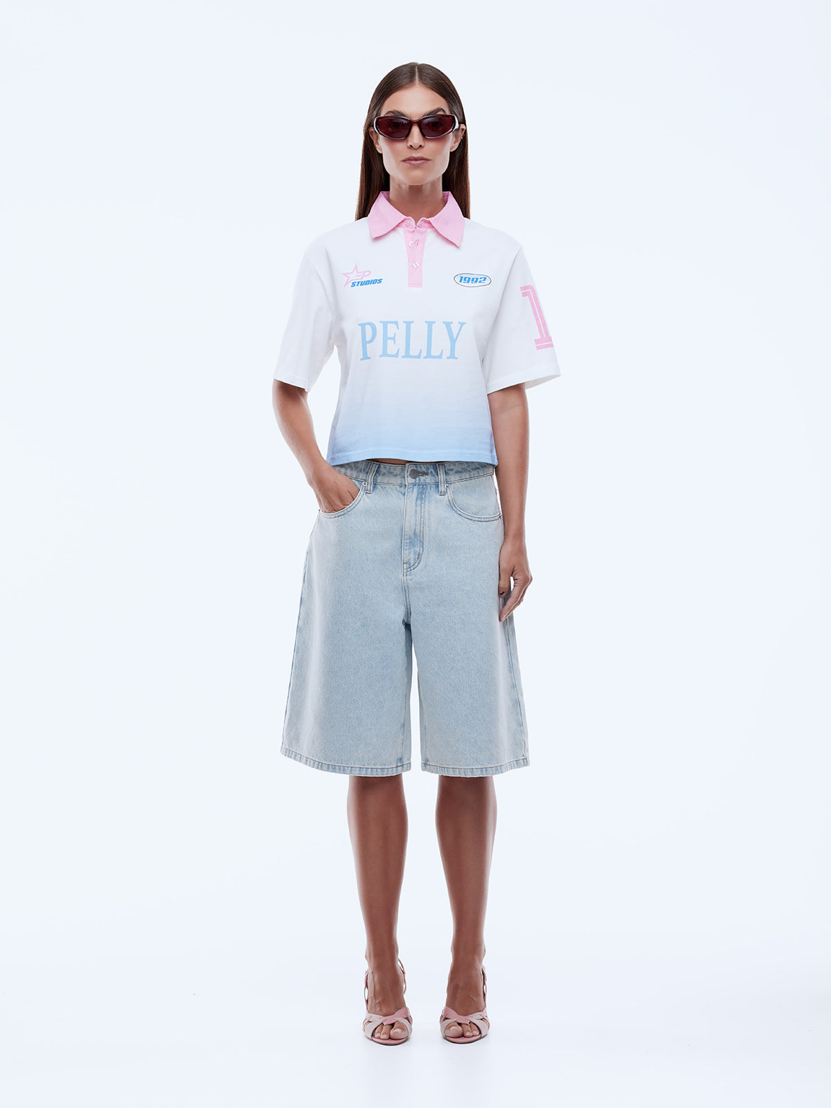 Close-up of a roulette wheel and chips on a green casino table.